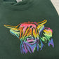 Green sweatshirt with a colourful embroidered highland cow design.