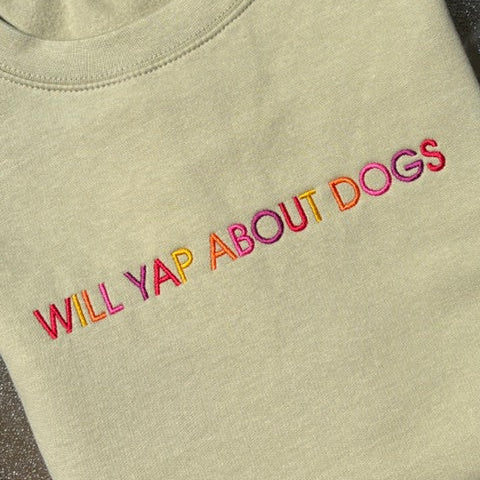 Will Yap About Dogs on the front of a Pistachio coloured sweatshirt