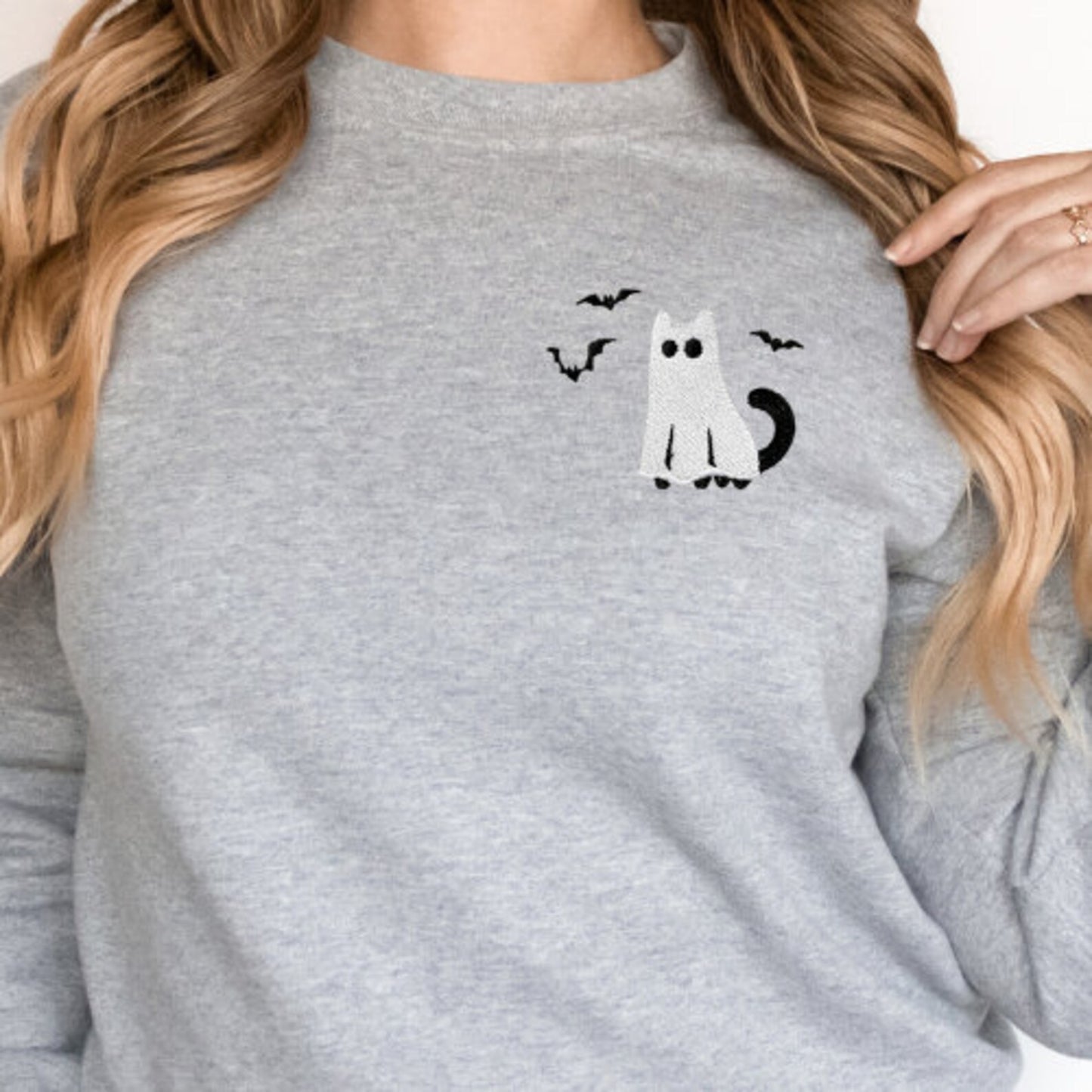Grey sweatshirt with a black cat and bats embroidery design on the chest