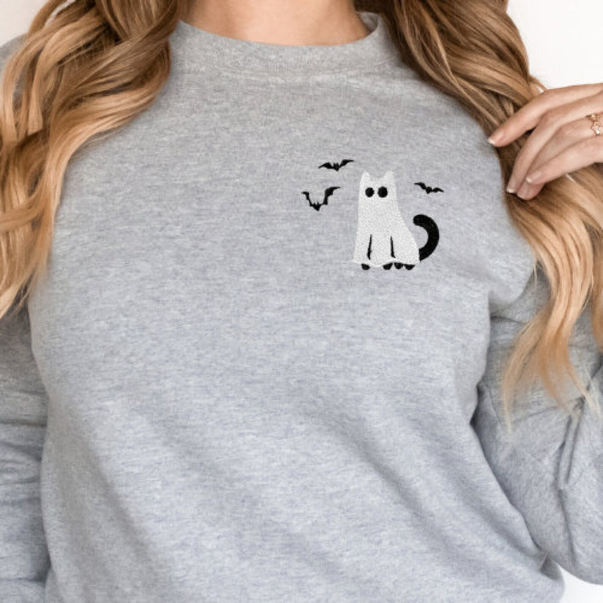 Grey sweatshirt with a black cat and bats embroidery design on the chest