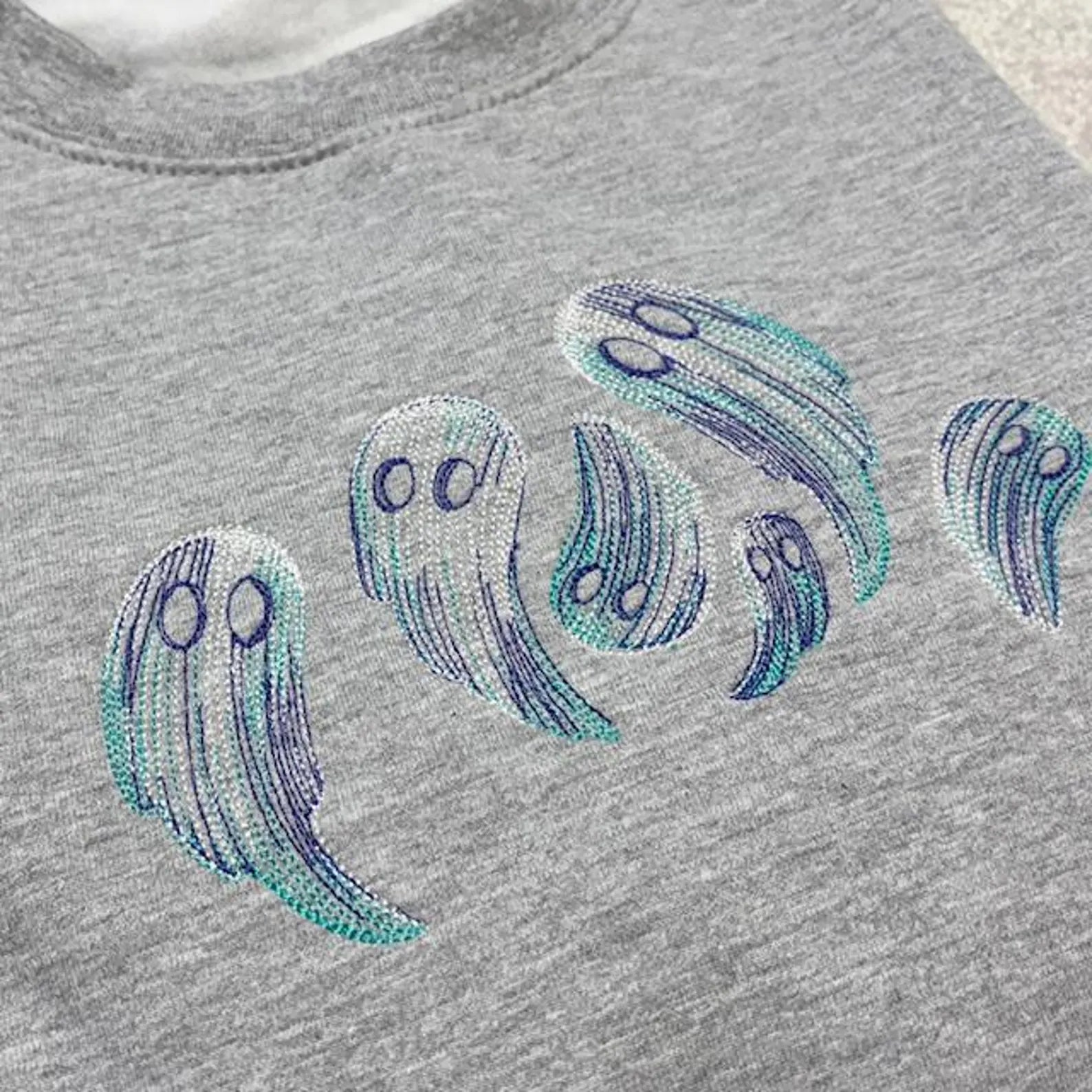 Grey sweatshirt with sketch style ghosts embroidered
