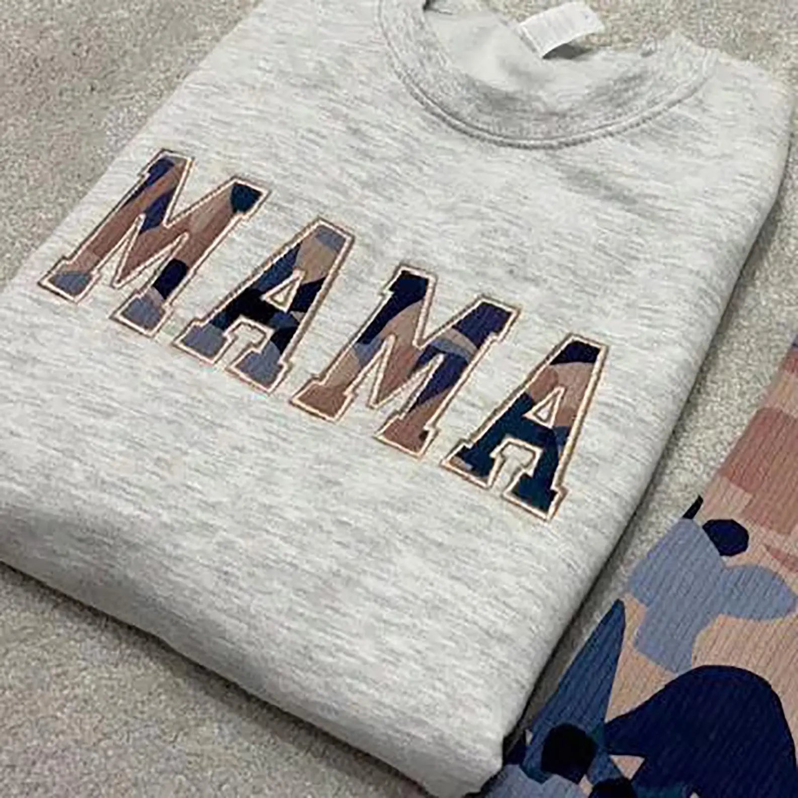 Grey sweatshirt with 'MAMA' appliqued using outgrown babygrow