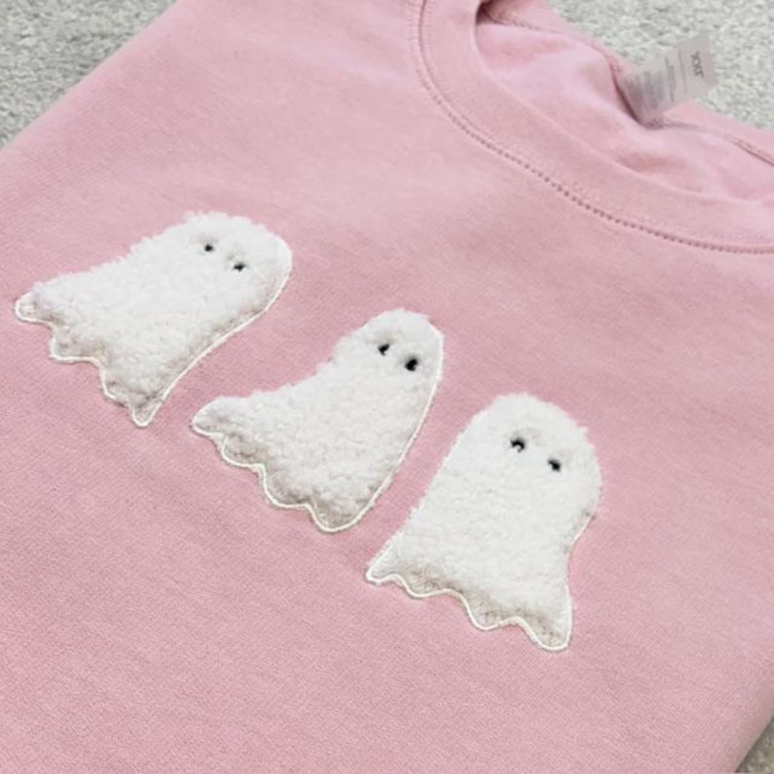 Pink sweatshirt with white ghost trio appliqued
