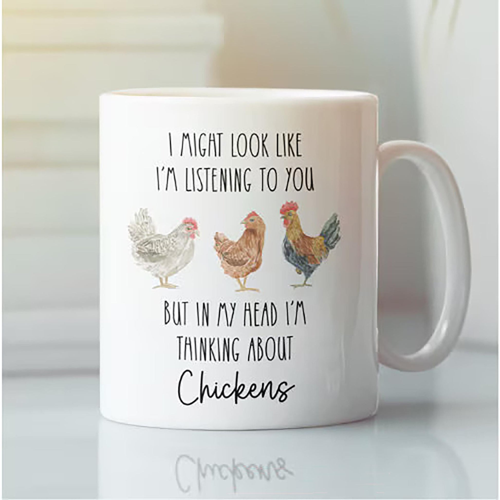 White mug with chicken illustrations and text on a white background
